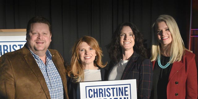 Oregon GOP gubernatorial candidate Christine Drazan, second from left, poses with supporters.