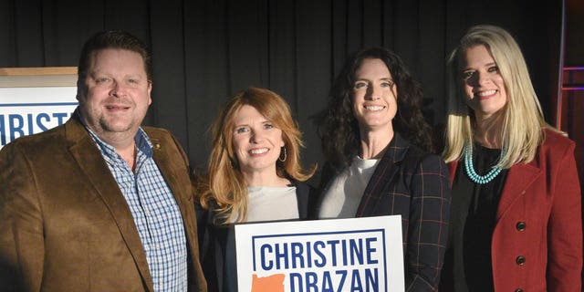 Oregon GOP gubernatorial candidate Christine Drazan, second from left, poses with supporters.