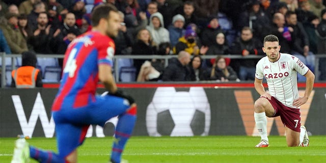 Aston Villa's John McGinn (right) and Crystal Palace's Luka Milivojevic take a knee prior to kick-off during the Premier League match at Selhurst Park, London. Picture date: Saturday November 27, 2021.