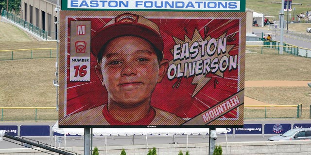 A picture of Mountain Region Champion Little League team member Easton Oliverson, from Santa Clara, Utah, is shown on the scoreboard at Volunteer Stadium in South Williamsport, Pennsylvania, during the opening ceremony of the 2022 Little League World Series.