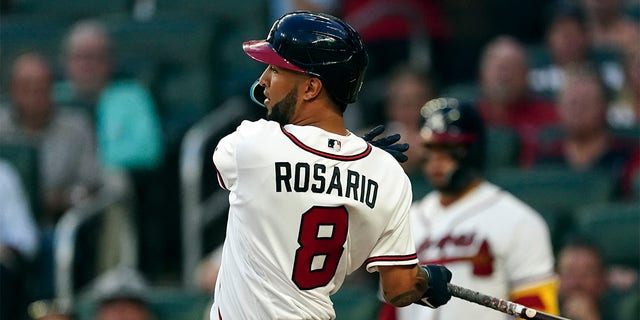 Atlanta Braves' Eddie Rosario follows through on a two-run base hit in the third inning of a baseball game against the Philadelphia Phillies Tuesday, Aug. 2, 2022, in Atlanta. 