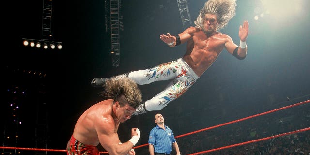 Edge dropkick Eddie Guerrero.