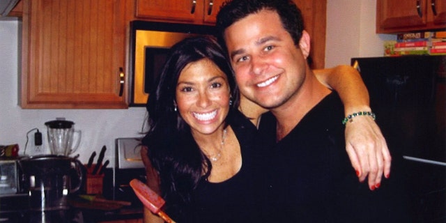 Ellen Greenberg smiling with her arm around a man