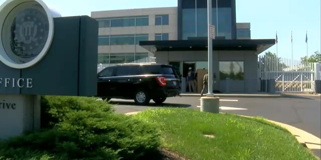 Investigators outside the FBI Cincinnati Field Office after an armed suspect showed and fled the scene.