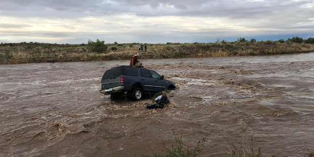 The driver became stranded after attempting to cross the Felix River outside of Roswell.