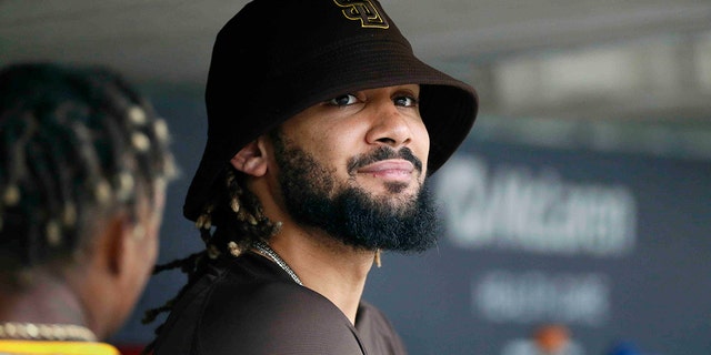 Fernando Tatis Jr. of the San Diego Padres watches the game against the Detroit Tigers from the dugout at Comerica Park on July 27, 2022, in Detroit.