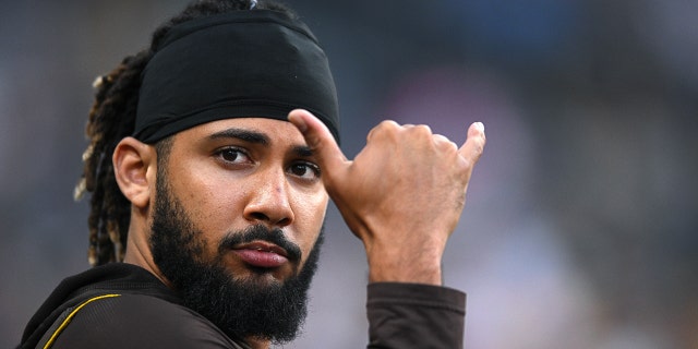 San Diego Padres shortstop Fernando Tatis Jr., #23, gestures toward the stands during the sixth inning against the Arizona Diamondbacks at Petco Park in San Diego July 16, 2022.