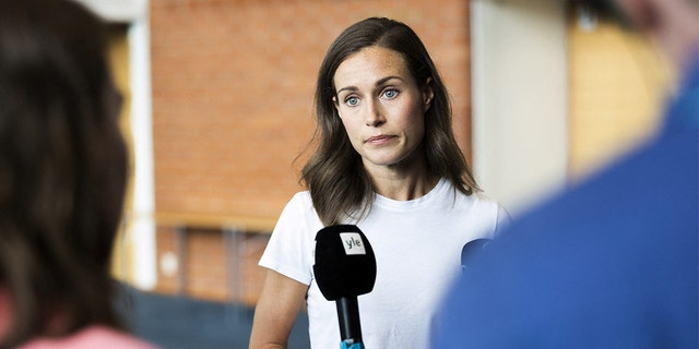 Finland's Prime Minister Sanna Marin speaks with members of the media in Kuopio, Finland, on Thursday, Aug. 18, 2022.