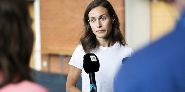 Finland's Prime Minister Sanna Marin speaks with members of the media in Kuopio, Finland, on Thursday, Aug. 18, 2022.