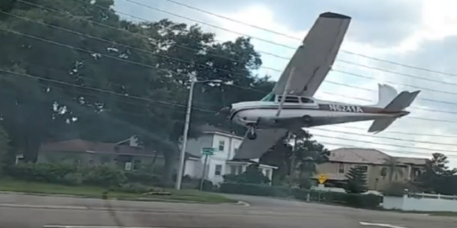 The Cessna 182 plane is seen crashing on Friday, Aug. 19, in Orlando, Fla.