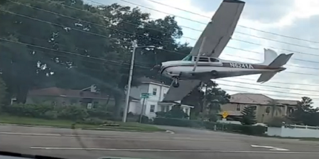 The Cessna 182 plane is seen crashing on Friday, Aug. 19, in Orlando, Fla.