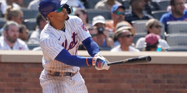 Francisco Lindor of the New York Mets watches the ball after an RBI double in the sixth inning during Game 1 of a doubleheader against the Atlanta Braves in New York City on Aug. 6, 2022.