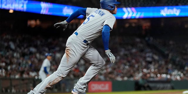 Los Angeles Dodgers' Freddie Freeman watches his RBI single during the ninth inning of a baseball game against the San Francisco Giants in San Francisco, Monday, Aug. 1, 2022.