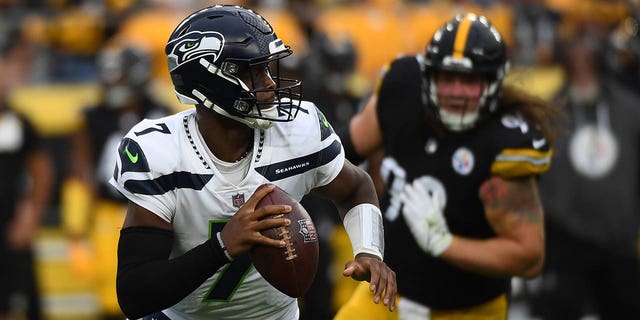 Geno Smith (7) of the Seattle Seahawks in action during a preseason game against the Pittsburgh Steelers at Acrisure Stadium Aug. 13, 2022, in Pittsburgh.