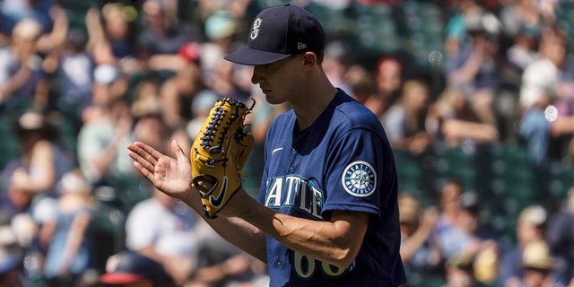 Seattle Mariners starting pitcher George Kirby reacts while walking off the field during the fifth inning of a baseball game against the Washington Nationals, Wednesday, Aug. 24, 2022, in Seattle.