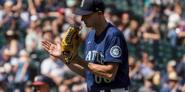 Seattle Mariners starting pitcher George Kirby reacts while walking off the field during the fifth inning of a baseball game against the Washington Nationals, Wednesday, Aug. 24, 2022, in Seattle.