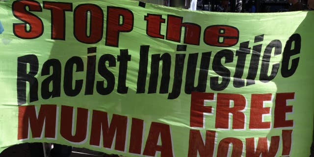 Free-Mumia protestors gather outside the Criminal Justice Center in Center City Philadelphia, PA, on August 30, 2013.