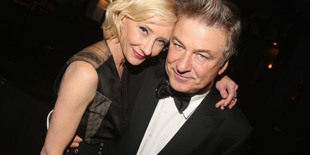 Anne Heche and Alec Baldwin pose at the Patricks Restaurant and Oyster Bar in Times Square on April 29, 2019, in New York City.