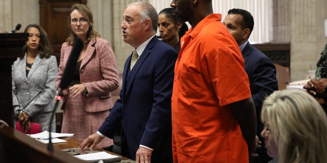Singer R. Kelly stands beside lawyer Steven Greenberg during a hearing at the Leighton Criminal Courthouse Sept. 17, 2019, in Chicago.