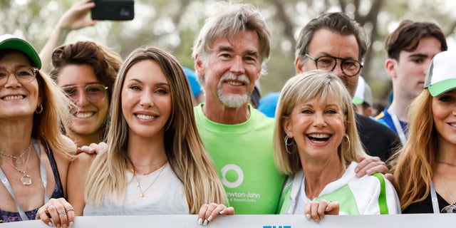 Chloe Lattanzi and John Easterling supported Olivia Newton-John at her annual benefit for cancer research and wellness center in Melbourne, Australia. 