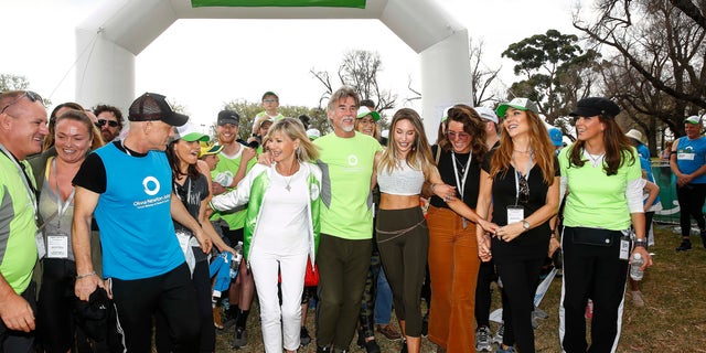 Olivia Newton John, John Easterling, Chloe Lattanzi and Yvette Napir (far right) attend Olivia Newton-John Wellness Walk and Research Run on in Melbourne, Australia in 2019. 