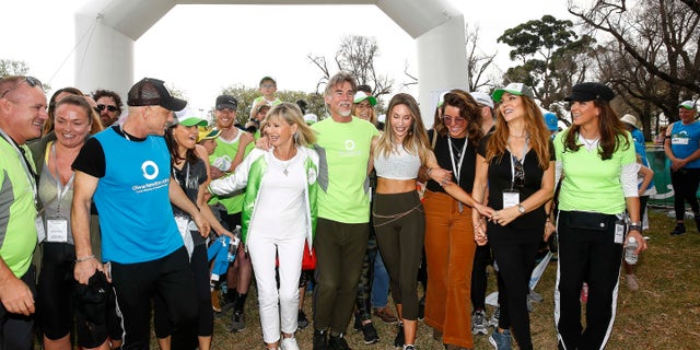 Olivia Newton John, John Easterling, Chloe Lattanzi and Yvette Napir (far right) attend Olivia Newton-John Wellness Walk and Research Run on in Melbourne, Australia in 2019. 