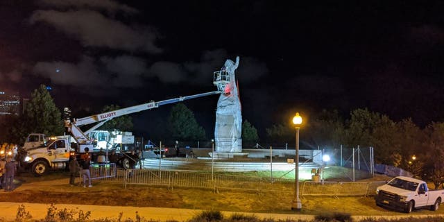 A statue of Christopher Columbus at Grant Park in Chicago is removed early on July 24, 2020.