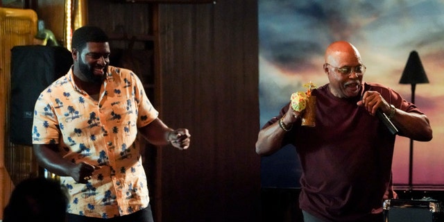 Roger E. Mosley, who played TC in the original Magnum, P.I., returned as a different character, "Booky." Pictured L-R: Stephen Hill as the new Theodore "TC" Calvin and Roger E. Mosley as John Booky