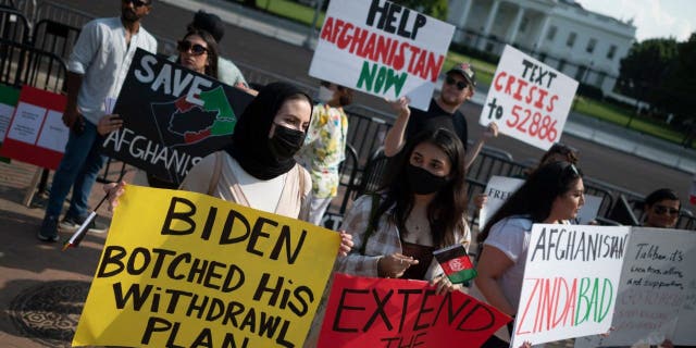 Protesters demonstrate in front of the White House, on Aug. 28, 2021.