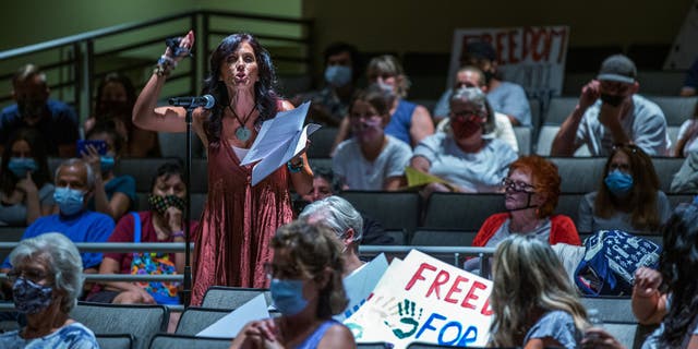 A mom speaks against the state masking mandate for schools during the Redlands Unified School District in 2021.