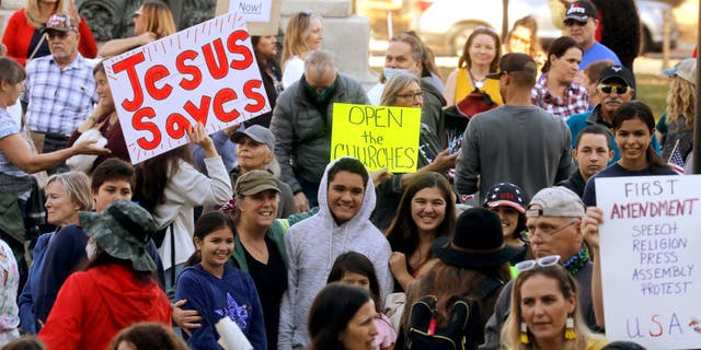 Supporters of Calvary Chapel gather in St. James Park outside of Santa Clara Superior Court in downtown San Jose, California, on Dec. 8, 2020.
