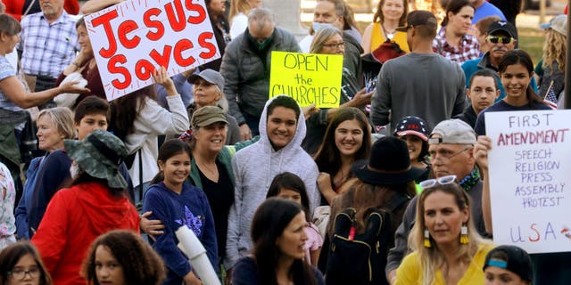 Supporters of Calvary Chapel gather in St. James Park outside of Santa Clara Superior Court in downtown San Jose, California, on Dec. 8, 2020.