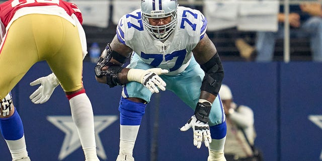 Dallas Cowboys offensive tackle Tyron Smith, #77, in action during the NFC Wild Card game between the San Francisco 49ers and the Dallas Cowboys on January 16, 2022, at AT&amp;T Stadium in Arlington, Texas. 