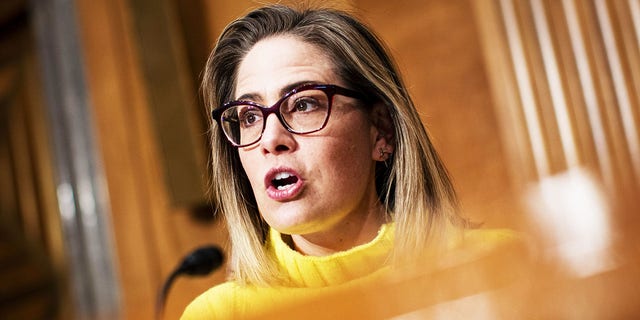 Sen. Kyrsten Sinema, D-Arizona, is facing backlash from progressives over her move to eliminate the carryforward tax loophole used by wealthy Americans from the Inflation Reduction Act.