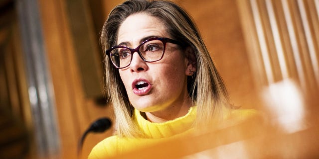 Sen. Kyrsten Sinema, D-Arizona, is facing backlash from progressives over her move to eliminate the carryforward tax loophole used by wealthy Americans from the Inflation Reduction Act.