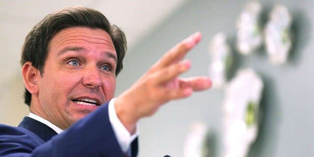 Florida Gov. Ron DeSantis, shown here in January 2021, is proposing hiring an elections crimes staff larger than most police departments have to solve murders. 