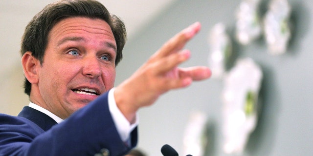 Florida Gov. Ron DeSantis, shown here in January 2021, is proposing hiring an elections crimes staff larger than most police departments have to solve murders.