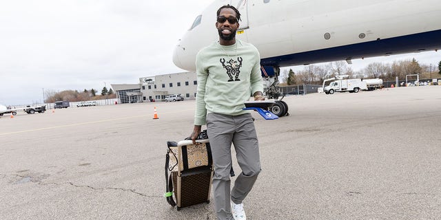 Patrick Beverley of the Timberwolves boards the plane before a playoff game against the Memphis Grizzlies, at Minneapolis-St. Paul International Airport on April 25, 2022.
