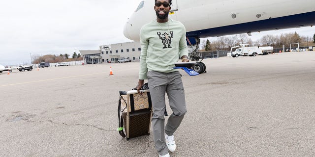Patrick Beverley of the Timberwolves boards the plane before a playoff game against the Memphis Grizzlies, at Minneapolis-St. Paul International Airport on April 25, 2022.