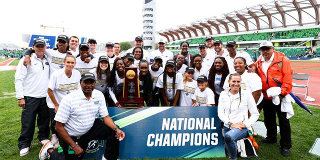 The Florida Gators women's track and field team poses for a photo with the trophy after winning the national championship during the Division I Men's and Women's Outdoor Track & Field Championships held at Hayward Fields. The contract of Head Coach Mike Holloway, bottom left, has been extended through 2032.