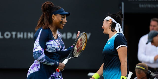 Serena Williams of the United States and Ons Jabeur of Tunisia speak during a match against Hao-Ching Chan of Chinese Taipei and Shuko Aoyama of Japan in their doubles quarterfinal match during the Rothesay International at Devonshire Park on June 22, 2022, in Eastbourne, England 