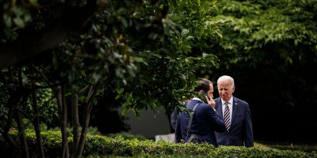 US President Joe Biden talks to Stephen Goepfert, Special Assistant and Personal Aide to the President, in the Jacqueline Kennedy Garden at the White House before boarding Marine One in Washington, DC, on July 6, 2022. - President Biden travels to Ohio to speak about the American Rescue Plan. SAMUEL CORUM/AFP via Getty Images)