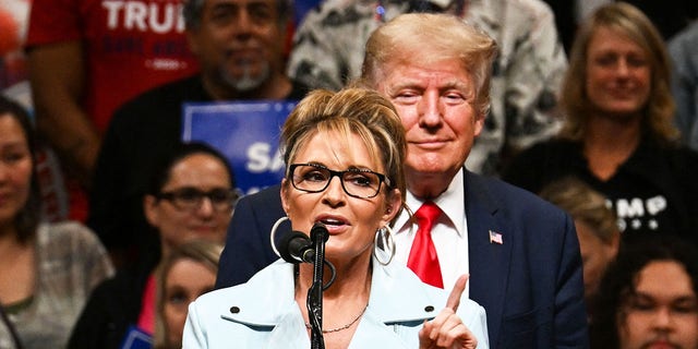 Alaska GOP House candidate Sarah Palin speaks alongside former US President Donald Trump during a "Save America" rally in Anchorage, Alaska on July 9, 2022.