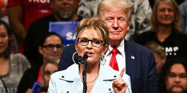 Alaska GOP House candidate Sarah Palin speaks alongside former US President Donald Trump during a "Save America" rally in Anchorage, Alaska on July 9, 2022.