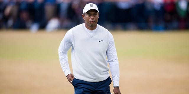 Tiger Woods walks the 18th green during Day 2 of the 150th Open St Andrews Old Course in St Andrews, Scotland, July 15, 2022. 