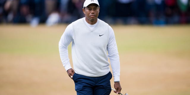 Tiger Woods walks the 18th green during Day 2 of the 150th Open St Andrews Old Course in St Andrews, Scotland, July 15, 2022. 