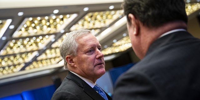 Mark Meadows, former White House chief of staff, speaks with an attendee during the America First Policy Institute's America First Agenda summit in Washington, D.C., on July 25, 2022. 