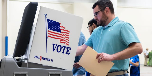 Voters cast their ballots at the West Evangelical Free church in Wichita, Kansas, on Tuesday, August 2nd, 2022, as voters decide on a constitutional amendment regarding abortion.