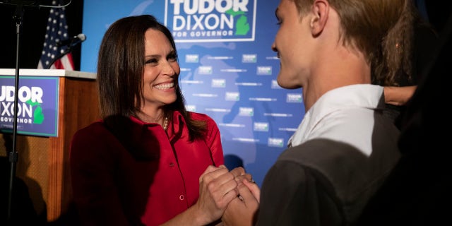 GRAND RAPIDS, MI: Michigan Republican gubernatorial candidate Tudor Dixon (L) celebrates her win on primary election night at the Amway Grand Plaza. 