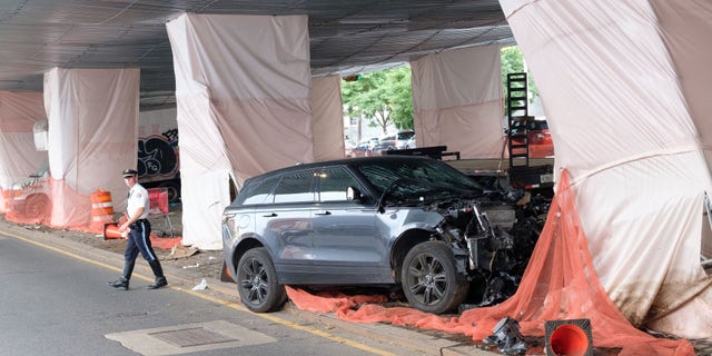 The NYPD Highway Patrol investigates after a Range Rover struck a pillar under the Gowanus Expressway on 3rd Avenue near 52nd Street in Brooklyn, New York City on Friday, July 29, 2022.